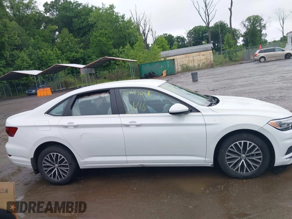 2021 Volkswagen Jetta S z VIN 3VWC57BU9MM103778, wystawiony jako IAAI lot #42493041 z przebiegiem 74 723 mil mil oraz . Historia ofert i sprzedaży dostępna na DreamBid. Obrazek 13.