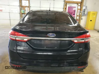 2018 Ford Fusion SE z VIN 3FA6P0H77JR277923, wystawiony jako Copart lot #56897455 z przebiegiem 154 432 mil mil oraz Czysty tytuł • Clean title. Historia ofert i sprzedaży dostępna na DreamBid. Obrazek 6.