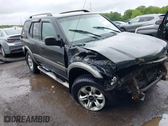 2003 Isuzu Rodeo with VIN 4S2DM58W234312253, listed as a IAAI auction lot 42319453 with 187,939 mi miles and . Bid and sale history available at DreamBid. Image 1.