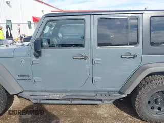 2014 Jeep Wrangler Unlimited Sport with VIN 1C4BJWDG9EL309763, listed as a IAAI auction lot 41378132 with 117,029 mi miles. Bid and sale history available at carsss.com. Image 14.