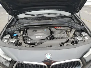 2018 BMW X2 sDrive28i with VIN WBXYJ3C34JEJ91176, listed as a Copart auction lot 63418365 with 62,586 mi miles and Salvage title. Bid and sale history available at DreamBid. Image 12.