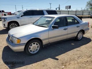 1995 Mercedes-Benz C with VIN WDBHA28E7SF255142, listed as a Copart auction lot 68411704 with 334,000 mi miles and Salvage Title. Bid and sale history available at carsss.com. Image 1.