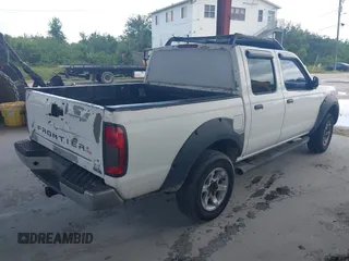 2001 Nissan Frontier SE z VIN 1N6ED27T61C300323, wystawiony jako IAAI lot #42401852 z przebiegiem 317 648 mil mil oraz . Historia ofert i sprzedaży dostępna na DreamBid. Obrazek 4.
