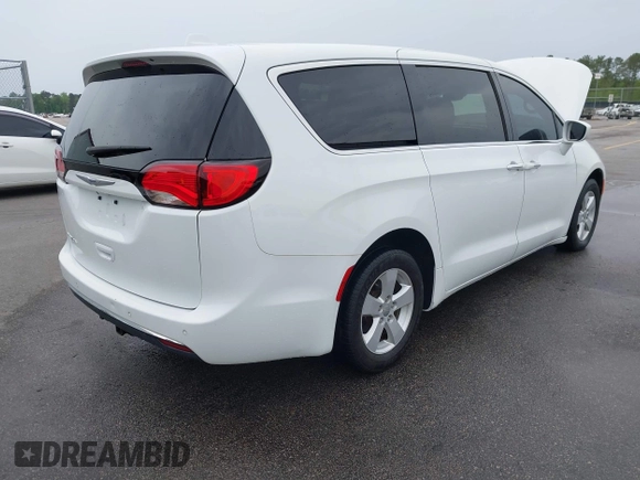 2020 Chrysler Pacifica Touring with VIN 2C4RC1FG4LR135808, listed as a IAAI auction lot 41932205 with 152,073 mi miles and . Bid and sale history available at DreamBid. Image 4.