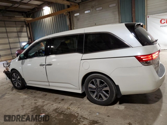 2014 Honda Odyssey Touring with VIN 5FNRL5H90EB137575, listed as a Copart auction lot 54606535 with 168,714 mi miles and Salvage title. Bid and sale history available at DreamBid. Image 2.