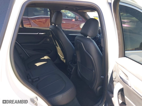 2017 BMW X1 xDrive28i with VIN WBXHT3C30H5F68187, listed as a IAAI auction lot 41830892 with 101,313 mi miles. Bid and sale history available at carsss.com. Image 8.