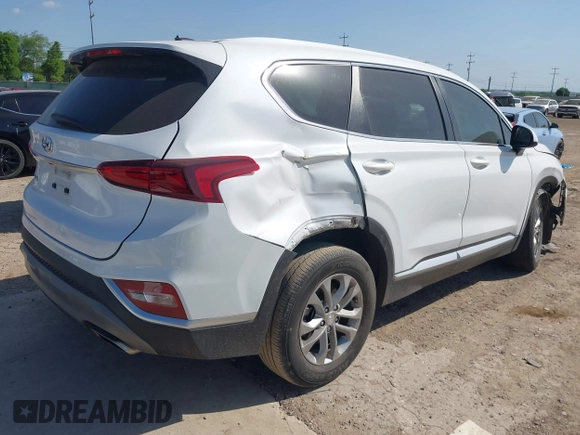 2019 Hyundai Santa Fe SE with VIN 5NMS23AD8KH051223, listed as a IAAI auction lot 42017754 with 146,704 mi miles and . Bid and sale history available at DreamBid. Image 4.