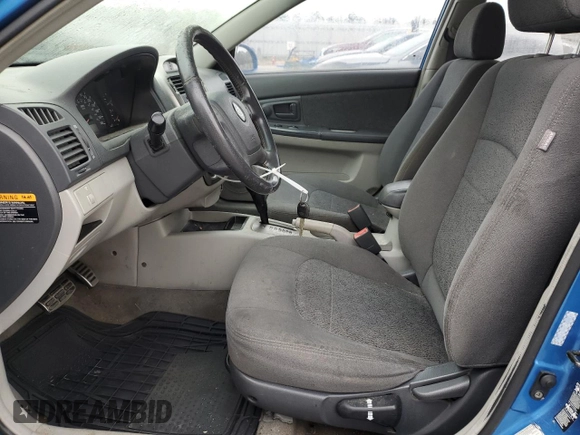 2005 Kia Spectra with VIN KNAFE161955108612, listed as a Copart auction lot 79648514 with 156,963 mi miles and Salvage Title. Bid and sale history available at carsss.com. Image 7.