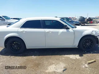 2009 Chrysler 300 Touring with VIN 2C3KA53V89H634048, listed as a IAAI auction lot 41974629 with Not Provided miles and . Bid and sale history available at DreamBid. Image 13.