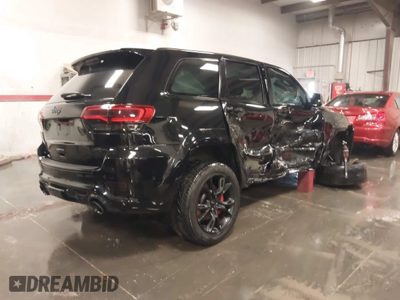 2017 Jeep Grand Cherokee SRT with VIN 1C4RJFDJ9HC739324, listed as a IAAI auction lot 40898998 with 92,547 mi miles. Bid and sale history available at carsss.com. Image 4.