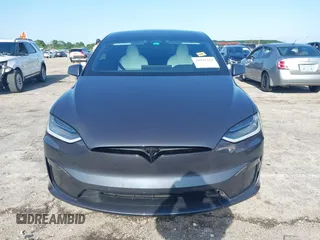 2022 Tesla Model X with VIN 7SAXCDE54NF342256, listed as a IAAI auction lot 41991212 with 28,740 mi miles and . Bid and sale history available at DreamBid. Image 12.