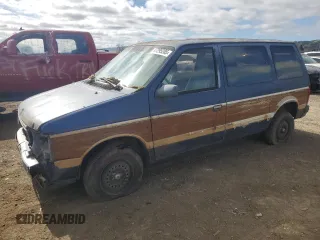 1987 Plymouth Voyager z VIN 2P4FH51G8HR130018, wystawiony jako Copart lot #47295285 z przebiegiem 68 113 mil mil oraz Tytuł czysty. Historia ofert i sprzedaży dostępna na DreamBid. Obrazek 1.
