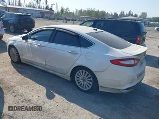 2016 Ford Fusion Titanium Hybrid with VIN 3FA6P0RU2GR357739, listed as a IAAI auction lot 42120441 with 151,201 mi miles. Bid and sale history available at carsss.com. Image 3.
