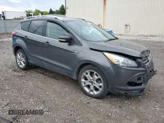 2015 Ford Escape Titanium with VIN 1FMCU9J96FUB32972, listed as a Copart auction lot 62886145 with 215,769 mi miles and Salvage title. Bid and sale history available at DreamBid. Image 4.