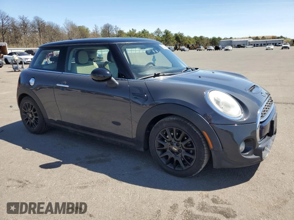 2014 MINI Hardtop S with VIN WMWXM7C54ET985344, listed as a Copart auction lot 55242945 with 87,017 mi miles and Salvage Title. Bid and sale history available at DreamBid. Image 4.
