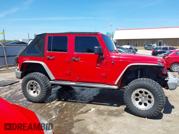 2008 Jeep Wrangler Unlimited X z VIN 1J4GA39198L652015, wystawiony jako IAAI lot #42062691 z przebiegiem 127 804 mil mil oraz . Historia ofert i sprzedaży dostępna na DreamBid. Obrazek 13.