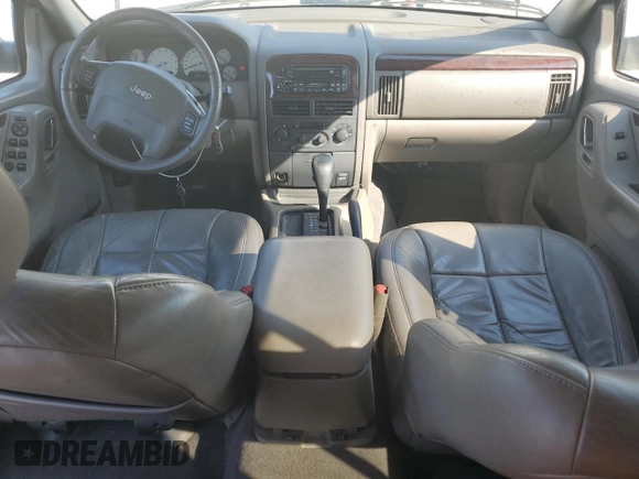 2002 Jeep Grand Cherokee Limited with VIN 1J4GX58N12C282300, listed as a Copart auction lot 74939754 with 166,018 mi miles and Salvage Title. Bid and sale history available at DreamBid. Image 8.