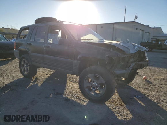 1998 Jeep Grand Cherokee Laredo with VIN 1J4FX58S4WC102623, listed as a Copart auction lot 86188764 with 283,210 mi miles and Salvage Title. Bid and sale history available at carsss.com. Image 4.