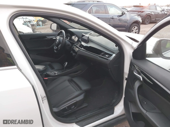 2020 BMW X2 sDrive28i with VIN WBXYH9C02L5R10335, listed as a IAAI auction lot 40651317 with 67,897 mi miles. Bid and sale history available at carsss.com. Image 5.