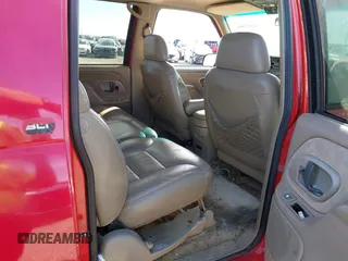 1999 GMC Suburban with VIN 1GKFK16RXXJ809823, listed as a IAAI auction lot 41687406 with 360,799 mi miles. Bid and sale history available at carsss.com. Image 8.