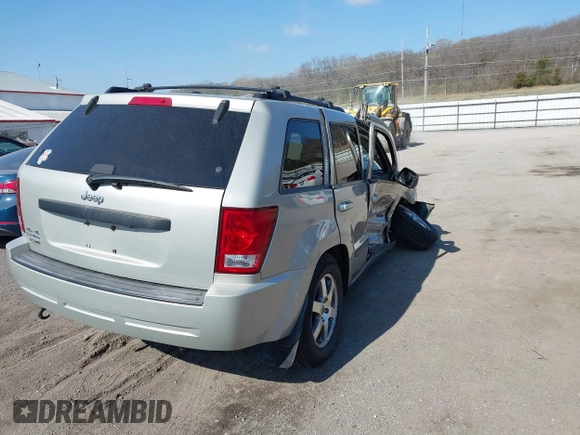 2008 Jeep Grand Cherokee Laredo with VIN 1J8GR48K28C169859, listed as a IAAI auction lot 41965149 with 166,069 mi miles. Bid and sale history available at carsss.com. Image 4.