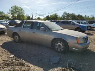 2001 Cadillac DeVille DHS z VIN 1G6KE57Y21U250470, wystawiony jako Copart lot #57334785 z przebiegiem 66 703 mil mil oraz Tytuł czysty. Historia ofert i sprzedaży dostępna na DreamBid. Obrazek 4.