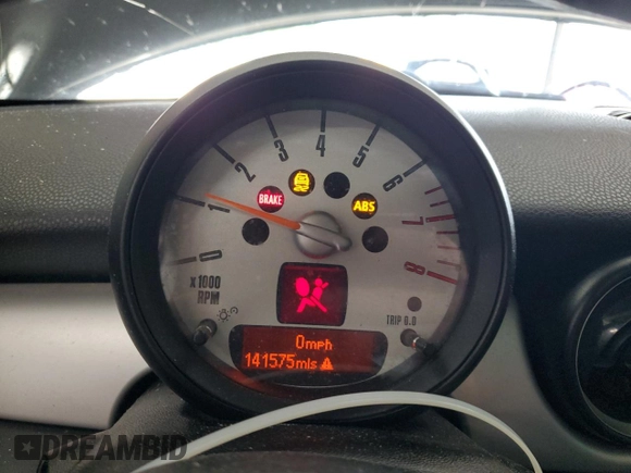 2011 MINI Hardtop with VIN WMWSU3C59BT099759, listed as a Copart auction lot 53995355 with 141,575 mi miles and Salvage Title. Bid and sale history available at DreamBid. Image 9.