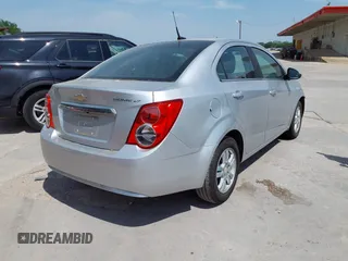 2014 Chevrolet Sonic LT with VIN 1G1JC5SH0E4210327, listed as a IAAI auction lot 42069313 with 94,506 mi miles and . Bid and sale history available at DreamBid. Image 4.
