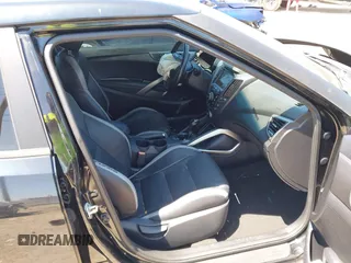2016 Hyundai Veloster Turbo with VIN KMHTC6AE5GU281597, listed as a IAAI auction lot 42006038 with 77,642 mi miles. Bid and sale history available at carsss.com. Image 5.