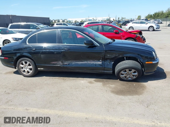 2003 Jaguar S-Type with VIN SAJEA01T13FM70486, listed as a IAAI auction lot 41989501 with 100,109 mi miles and . Bid and sale history available at DreamBid. Image 6.