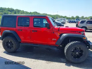 2018 Jeep Wrangler Unlimited Sport S z VIN 1C4HJXDGXJW168940, wystawiony jako IAAI lot #42200607 z przebiegiem 60 308 mil mil oraz . Historia ofert i sprzedaży dostępna na DreamBid. Obrazek 13.