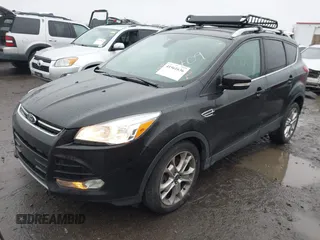 2015 Ford Escape Titanium with VIN 1FMCU0J97FUB45709, listed as a IAAI auction lot 41561636 with 88,296 mi miles. Bid and sale history available at carsss.com. Image 2.