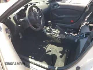 2016 Nissan 370Z with VIN JN1AZ4EH0GM933290, listed as a Copart auction lot 62025304 with 100,275 mi miles and Salvage Title. Bid and sale history available at carsss.com. Image 7.