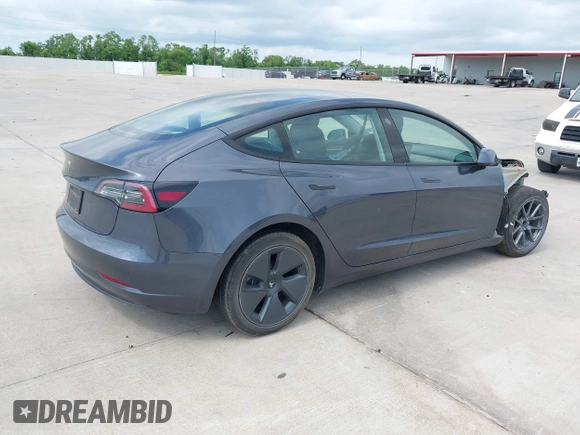 2023 Tesla Model 3 with VIN 5YJ3E1EA7PF417293, listed as a IAAI auction lot 42407659 with 22,578 mi miles and . Bid and sale history available at DreamBid. Image 4.