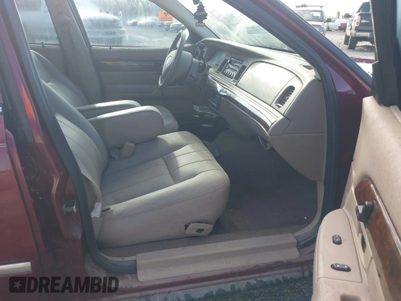 2004 Mercury Grand Marquis LS Premium z VIN 2MEFM75WX4X671041, wystawiony jako IAAI lot #42261517 z przebiegiem 107 182 mil mil oraz . Historia ofert i sprzedaży dostępna na DreamBid. Obrazek 5.