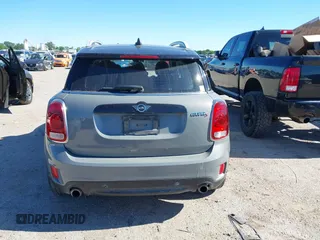 2019 MINI Countryman Cooper S z VIN WMZYT5C54K3G94548, wystawiony jako IAAI lot #42210212 z przebiegiem 82 505 mil mil oraz . Historia ofert i sprzedaży dostępna na DreamBid. Obrazek 16.