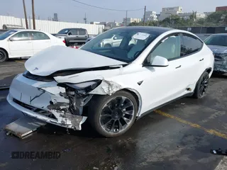2023 Tesla Model Y Long Range with VIN 7SAYGDEE3PF900030, listed as a IAAI auction lot 41147192 with 13,903 mi miles and . Bid and sale history available at DreamBid. Image 6.