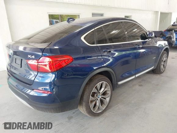 2015 BMW X4 xDrive28i with VIN 5UXXW3C51F0M87268, listed as a IAAI auction lot 42366363 with 143,285 mi miles and . Bid and sale history available at DreamBid. Image 4.