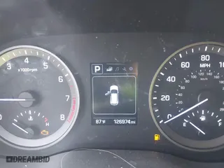 2016 Hyundai Tucson SE with VIN KM8J23A4XGU238521, listed as a IAAI auction lot 41886259 with 126,974 mi miles. Bid and sale history available at carsss.com. Image 7.