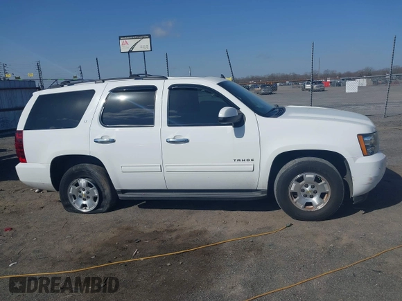 2014 Chevrolet Tahoe LT with VIN 1GNSCBE06ER233105, listed as a IAAI auction lot 41753190 with 161,056 mi miles and . Bid and sale history available at DreamBid. Image 13.