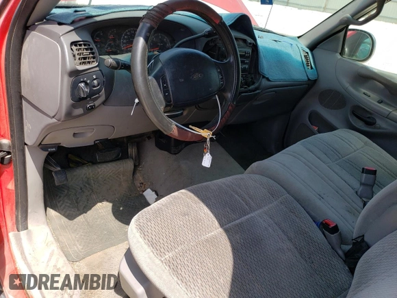 1998 Ford F-150 with VIN 1FTZX1761WKA53404, listed as a Copart auction lot 80628524 with 253,399 mi miles and Salvage title. Bid and sale history available at DreamBid. Image 8.