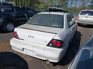 2003 Mitsubishi Lancer LS with VIN JA3AJ36E73U054672, listed as a IAAI auction lot 42002271 with 263,568 mi miles. Bid and sale history available at carsss.com. Image 4.