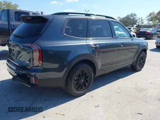 2024 Kia Telluride SX Prestige X-Line z VIN 5XYP5DGC9RG547945, wystawiony jako IAAI lot #41705605 z przebiegiem 7 308 mil mil oraz . Historia ofert i sprzedaży dostępna na DreamBid. Obrazek 4.