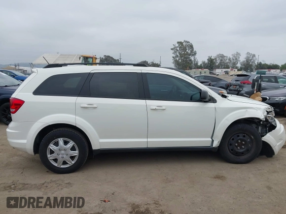 2014 Dodge Journey American Value with VIN 3C4PDCAB8ET141803, listed as a IAAI auction lot 42097292 with 76,339 mi miles and . Bid and sale history available at DreamBid. Image 13.