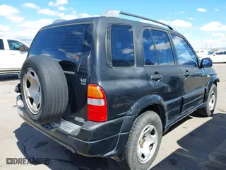 2001 Suzuki Grand Vitara JLX with VIN JS3TD62V414156342, listed as a IAAI auction lot 41762508 with 214,235 mi miles. Bid and sale history available at carsss.com. Image 4.