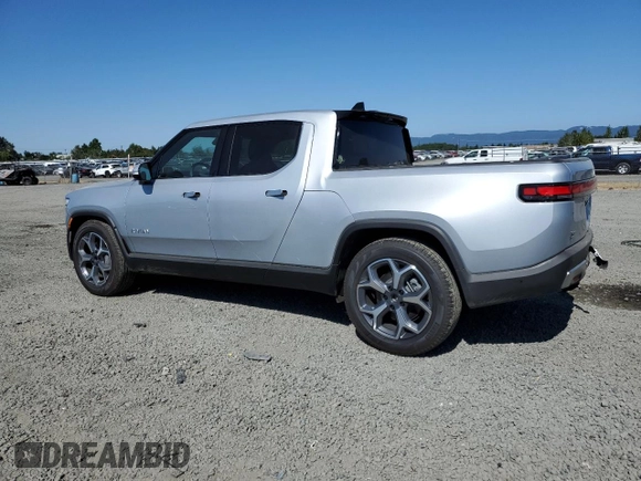 2023 Rivian R1T Adventure z VIN 7FCTGBAA0PN025046, wystawiony jako Copart lot #62502274 z przebiegiem 1385 mil mil oraz Szkody całkowita. Historia ofert i sprzedaży dostępna na DreamBid. Obrazek 2.