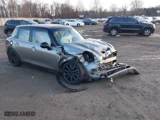 2016 MINI Cooper Hardtop 4 Door S with VIN WMWXU3C51G2D31390, listed as a IAAI auction lot 41173123 with 74,380 mi miles. Bid and sale history available at carsss.com. Image 1.