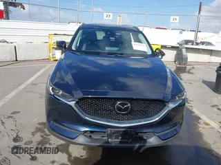 2021 Mazda CX-5 Grand Touring with VIN JM3KFBDM6M1312573, listed as a IAAI auction lot 41936739 with Not Provided miles and . Bid and sale history available at DreamBid. Image 11.