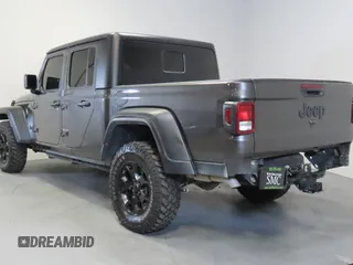 2023 Jeep Gladiator Freedom with VIN 1C6JJTAG9PL557861, listed as a Copart auction lot 56429485 with 44,716 mi miles and Salvage title. Bid and sale history available at DreamBid. Image 4.