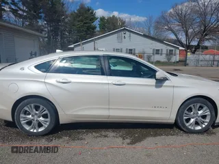 2014 Chevrolet Impala LT with VIN 1G1125S33EU101464, listed as a IAAI auction lot 41863521 with 215,270 mi miles and . Bid and sale history available at DreamBid. Image 14.